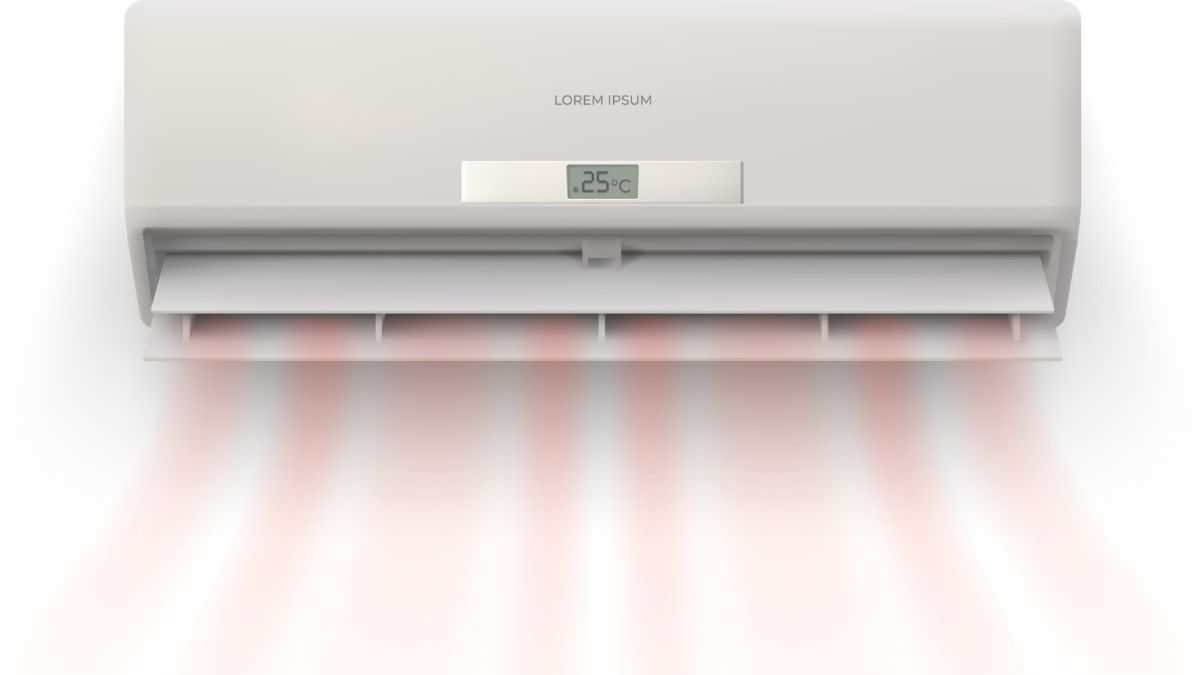 Een binnenunit van een airco met verwarmingsfunctie of lucht-lucht-warmtepomp verspreidt rode warme lucht door een kamer.
